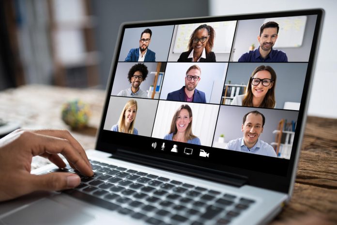 Cropped Image Of Businessman Using Laptop At Desk Zoom Meeting Spa Therapist Dubai - Dunia Masa Depan, Catat Tanggalnya